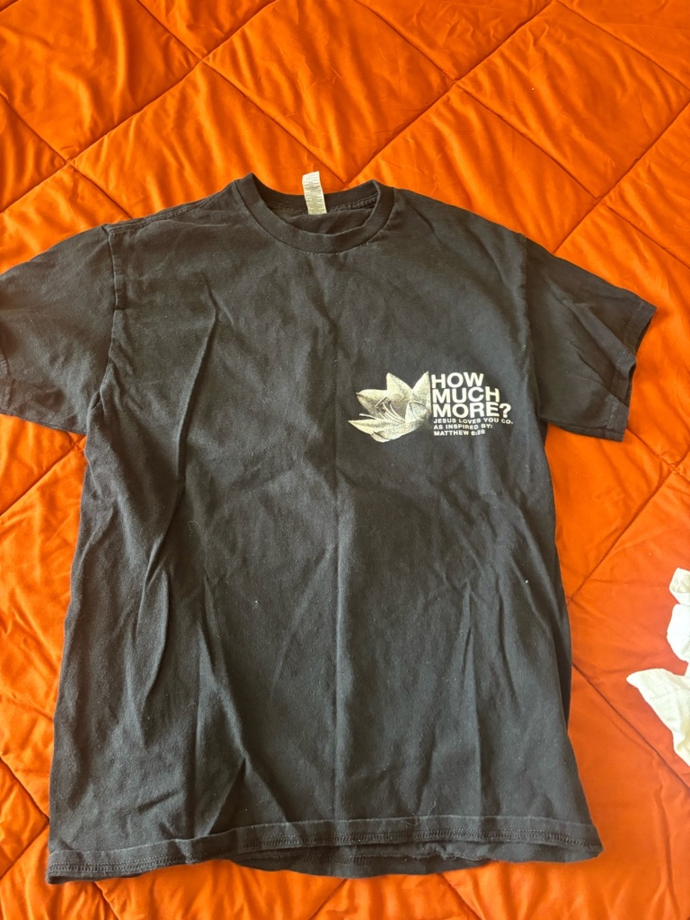 Black Graphic Tee with White Lotus and Slogan